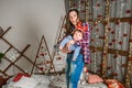 Baby with mother at Christmas. happy family mother and baby little son playing home on Christmas holidays. New Year`s holidays. Royalty Free Stock Photo