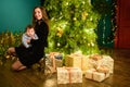 Baby with mother at Christmas. happy family mother and baby little son playing home on Christmas holidays. New Year`s holidays. Royalty Free Stock Photo