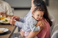 Baby, mother and family while sitting at a dining tablet and eating food at a gathering, lunch or supper. Portrait of Royalty Free Stock Photo