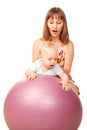 Baby with mother on fitness ball Royalty Free Stock Photo