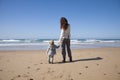 Baby and mother holding hands in beach Royalty Free Stock Photo