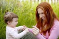 Baby and mother outdoor grass playing park