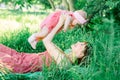 Baby with mother outdoors close to nature and have fun