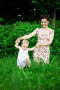 Baby and mother in park