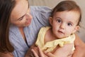 Baby, mother and portrait on couch, hug and infant growth with embrace, sitting and house. Girl, joyful and healthy in