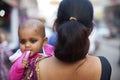 Baby in mother's arms in India