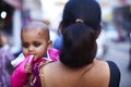 Baby in mothers arms in India