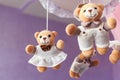Baby music mobile carousel with little bears. Toy carousel, above the baby bed. Baby bedroom close up element Royalty Free Stock Photo