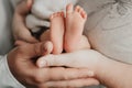 Baby newborn feet mother and father hands. New born kid foot