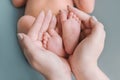 Baby Newborn Feet Mother Hands. New Born Kid Foot, Maternity Royalty Free Stock Photo