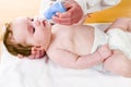 Baby with nose cleaner Royalty Free Stock Photo