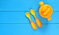 Baby nutrition concept background. Children fork, spoon and feeding bottle