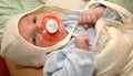 Baby with pacifier Royalty Free Stock Photo