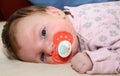 Baby with pacifier Royalty Free Stock Photo