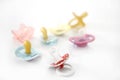 Baby pacifier set over white background