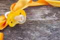 Baby pacifier on wooden table