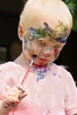 Baby Painting His Face Royalty Free Stock Photo