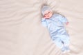 Baby in pajamas lying on bed Royalty Free Stock Photo