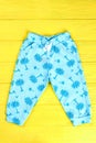 Baby palm tree print trousers. Royalty Free Stock Photo