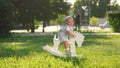 baby in the park. baby toddler swinging on a rocking horse toy in the park happy summer. happy family a kid dream Royalty Free Stock Photo