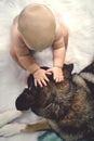 Baby Petting German Shepherd Dog
