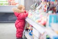 Baby picks a toy at the store