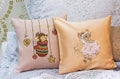 Baby pillows with embroidered mice. Decorative pillows in a children`s room