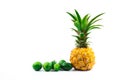 Baby pineapple exotic fruit with feijoa beautiful composition with negative space on white isolated background