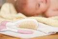 Close up of baby pink hairbrush on towel