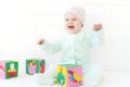 Baby playing with alphabet cube Royalty Free Stock Photo