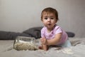 Baby playing on bed of beans, early development, natural toys, Royalty Free Stock Photo