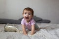 Baby playing on bed of beans, early development, natural toys, Royalty Free Stock Photo