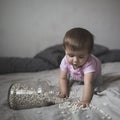 Baby playing on bed of beans, early development, natural toys, Royalty Free Stock Photo