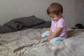 Baby playing on bed of beans, early development, natural toys, Royalty Free Stock Photo