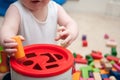 Baby playing with blocks and sorting shapes