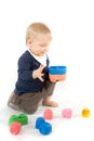 Baby playing with blocks on white background Royalty Free Stock Photo