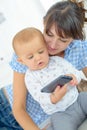 baby playing with cellular phone Royalty Free Stock Photo