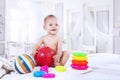 Baby playing with colorful toys