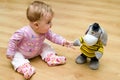 Baby playing with cuddly toy Royalty Free Stock Photo