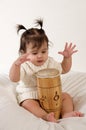 Baby playing with drum