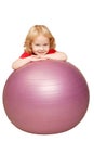 Baby playing with fitness ball. Royalty Free Stock Photo