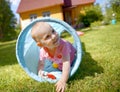 Baby playing inside a toy tunnel Royalty Free Stock Photo