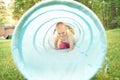 Baby playing inside a toy tunnel Royalty Free Stock Photo