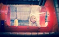 Baby playing inside a toy tunnel Royalty Free Stock Photo
