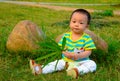 A baby playing on the lawn(Asia, China, Chinese) Royalty Free Stock Photo