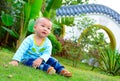 A baby playing on the lawn(Asia, China, Chinese)