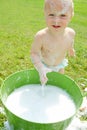 Baby Playing Outside in Bubbles Royalty Free Stock Photo