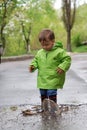 Baby playing in puddles Royalty Free Stock Photo