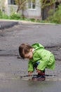 Baby playing in puddles Royalty Free Stock Photo