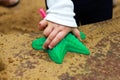 Baby is playing in the sandbox with plastic toy tools, starfish Royalty Free Stock Photo